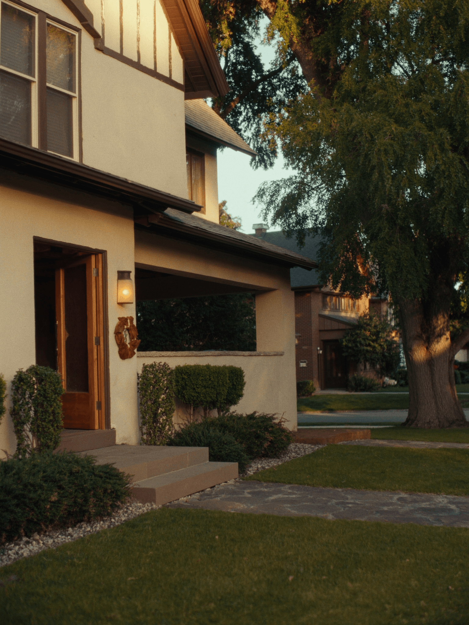 A charming craftsman home with a covered porch at golden hour